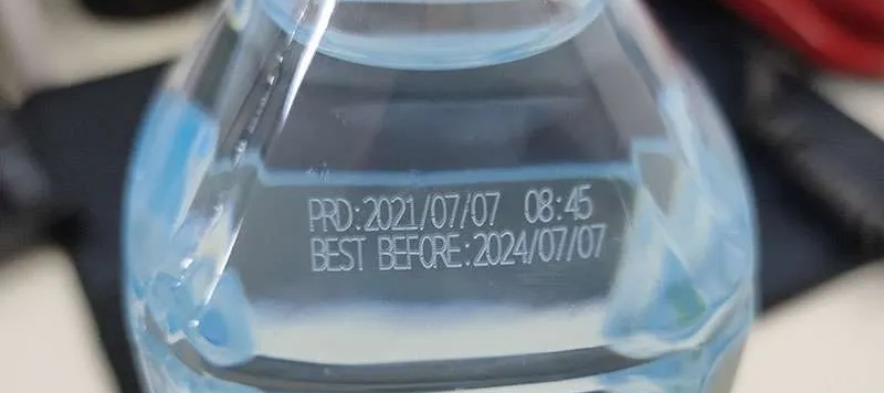 CO2 laser marking produced and best before date on plastic water bottle